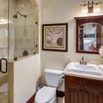 he grand foyer leads to the formal living room with 25+ ft. ceilings and a wraparound staircase. Gourmet kitchens feature Viking appliances, a built-in breakfast bar, and custom European cabinetry. Upstairs, the spacious primary suite features a fireplace and a luxurious ensuite bathroom with a steam shower, soaking tub, and two walk-in closets. A movie theater completes the main house.