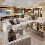 he grand foyer leads to the formal living room with 25+ ft. ceilings and a wraparound staircase. Gourmet kitchens feature Viking appliances, a built-in breakfast bar, and custom European cabinetry. Upstairs, the spacious primary suite features a fireplace and a luxurious ensuite bathroom with a steam shower, soaking tub, and two walk-in closets. A movie theater completes the main house.